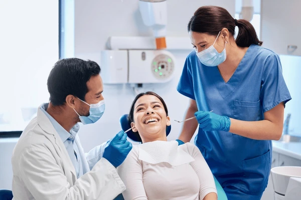 Dentist treating patient